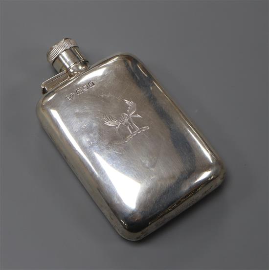 A George V silver hip flask by Goldsmiths & Silversmiths Co Ltd, London, 1913, with engraved crest, 110 grams.